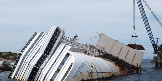 As the trial against the captain of Italy's Costa Concordia gets under way, the mayor of the island where the ship lies said he was increasingly concerned about its salvage.