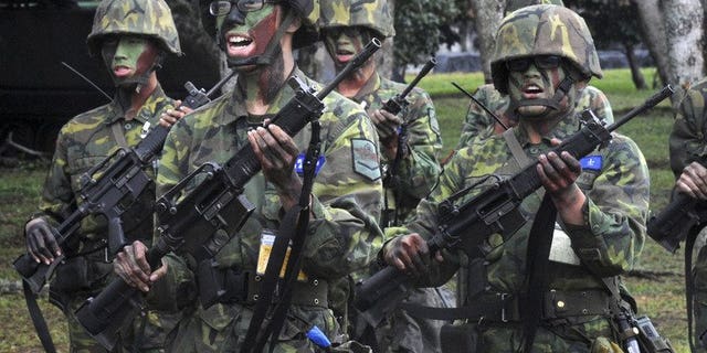 This file photo shows soldiers practising during a training session at the Hualien army base, on January 23, 2013. Taiwan's defence minister has apologised for the death of a corporal from heatstroke as the island's top government watchdog launches an investigation into bullying in the military, officials said on Tuesday.