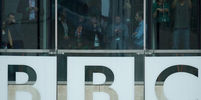Members of the BBC staff are seen in the of Broadcasting House in central London on June 7, 2013. The BBC has spent around ??5 million on inquiries related to the Jimmy Savile scandal, the broadcaster revealed in its annual report.