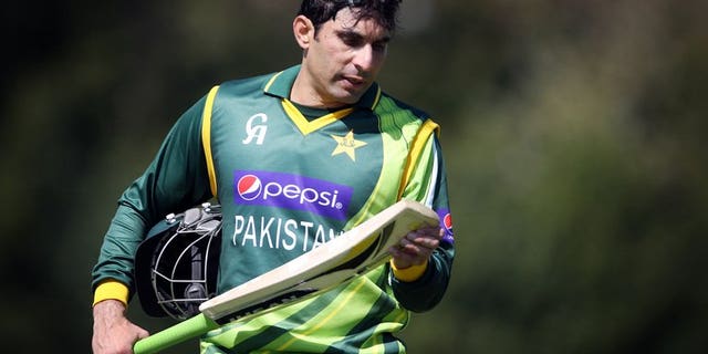 Pakistan's Misbah-ul-Haq looks at his bat during a one-day international in Edinburgh, on May 17, 2013. Misbah-ul-Haq has won the toss and put West Indies in to bat in the second one-day international of their five-match series at the Guyana National Stadium.