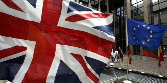 A European Flag and the Union Jack are seen in front of the EU headquarters building in Brussels in 2005. A British think-tank has launched a competition for the best plan to leave the EU -- offering a prize of 100,000 euros ($131,000) instead of in pounds.