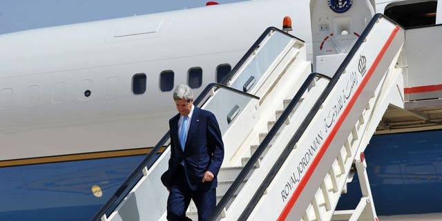 US Secretary of State John Kerry steps off his plane upon his arrival at Queen Alia International Airport in Amman, Jordan on July 16, 2013. Top US diplomat John Kerry met his Jordanian counterpart Tuesday for talks focused on the turmoil in Egypt and Syria as well as his bid to unlock the Middle East peace process.