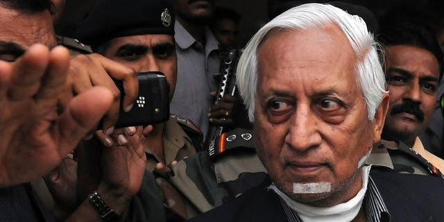 Retired Indian lieutenant general Kuldip Singh Brar (R) is escorted out of the Chattrapati Shivaji International Airport after his arrival from London in Mumbai on October 3, 2012. Brar, the Indian general who commanded the 1984 Amritsar Golden Temple assault, had his throat slashed in a deliberate revenge attack by a Sikh gang, a London court heard Tuesday.