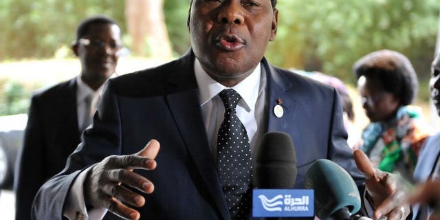 President of Benin, Thomas Boni Yayi, talks to the press on May 15, 2013 at EU headquarters in Brussels. His niece, his doctor and an ex-minister were accused of being part of a conspiracy to poison him by replacing his medicine.