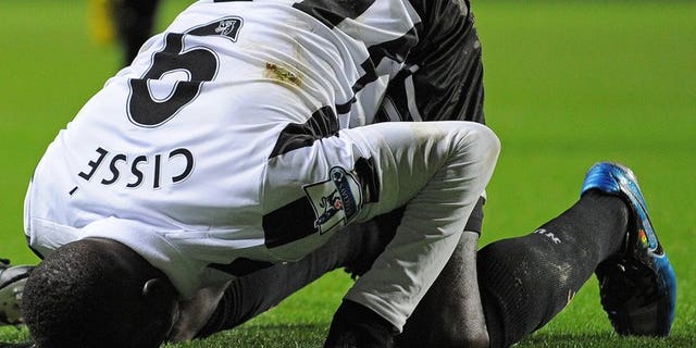 Newcastle United's Senegalese striker Papiss Cisse celebrates after scoring at Villa Park in Birmingham, West Midlands, England on January 29, 2013. Cisse has withdrawn from Newcastle's pre-season tour of Portugal after refusing to wear club sponsor Wonga's logo on religious grounds.
