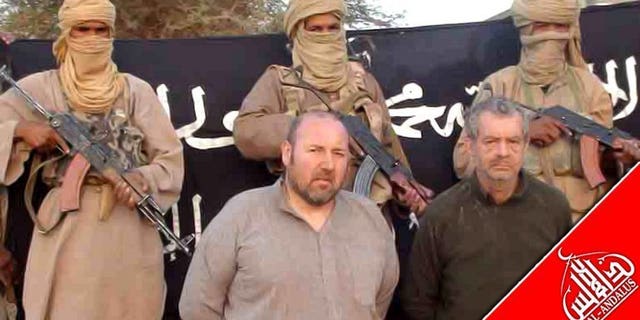 A picture released in December 2011 shows Philippe Verdon (right) and Serge Lazarevic at an undisclosed location. French hostage Verdon, who was kidnapped by Al-Qaeda in the Islamic Maghreb (AQIM) in Mali in 2011 and found dead several weeks ago, was executed with a shot to the head, prosecutors said Thursday