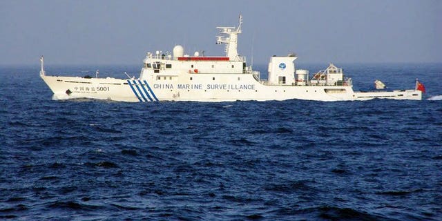 This handout picture taken by the Japan Coast Guard on June 27, 2013 shows a Chinese marine surveillance ship cruising near the disputed islets in the East China Sea. Three Chinese government ships sailed into waters around islands at the centre of a territorial dispute on Thursday, the day after Japan's premier visited coastguards who patrol the area.