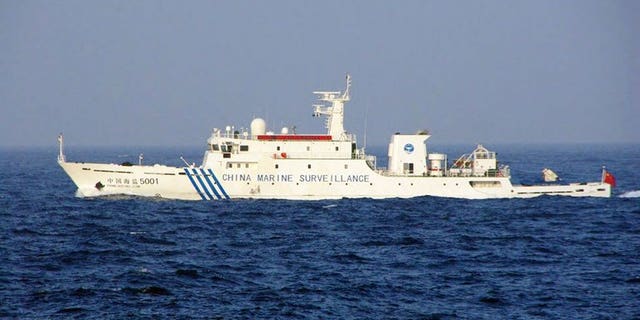This handout picture taken by the Japan Coast Guard on June 27, 2013 shows a Chinese marine surveillance ship cruising near the disputed islets in the East China Sea. Three Chinese government ships sailed into waters around islands at the centre of a territorial dispute on Thursday, the day after Japan's premier visited coastguards who patrol the area.