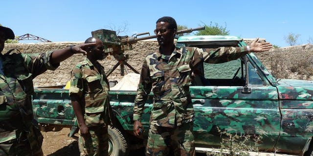 Ethiopian troops patroll at the entrance of an abandoned building in Baidoa, on March 2, 2012. Ethiopian troops who entered Somalia in November 2011 to help fight Al-Qaeda linked Shebab insurgents have begun their withdrawal from the key central city of Baidoa, the foreign ministry said Thursday.