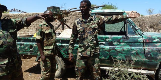 Ethiopian troops patroll at the entrance of an abandoned building in Baidoa, on March 2, 2012. Ethiopian troops who entered Somalia in November 2011 to help fight Al-Qaeda linked Shebab insurgents have begun their withdrawal from the key central city of Baidoa, the foreign ministry said Thursday.