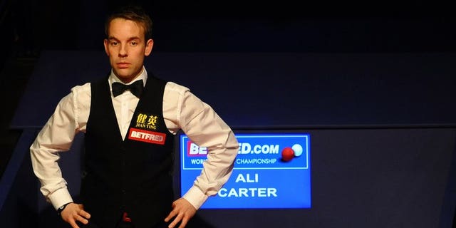 Ali Carter of England watches on May 7, 2012 during the third session of the World Championship Snooker final at the Crucible Theater in Sheffield, England. Carter will return to action at the Shanghai Masters after being given the all-clear from testicular cancer.