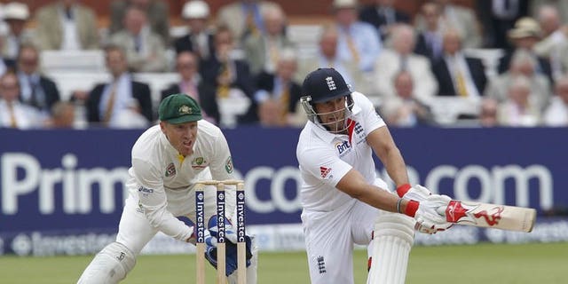 England's Tim Bresnan (right) plays a shot watched by Australia's wicketkeeper Brad Haddin during the third day of the second Ashes Test at Lord's in London, on July 20, 2013. England were 114 for three in their second innings, a lead of 347 runs, at lunch.