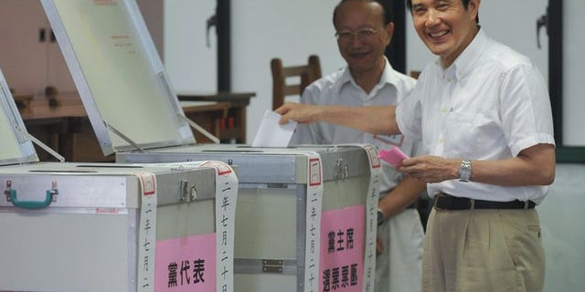 Taiwan President Ma Ying-jeou casts his ballot during an election for the ruling Kuomintang party in Taipei, on July 20, 2013. Ma has been overwhelmingly reelected chairman of the ruling party, amid corruption scandals involving top officials and public anger at his government.