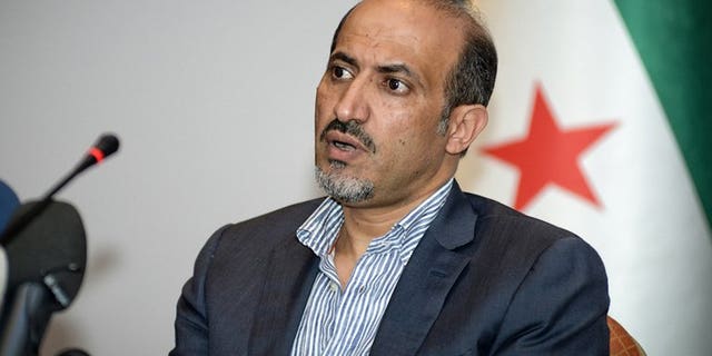 A handout photo taken and provided on July 9, 2013 shows Syrian National Coalition (SNC) leader Ahmad al-Assi attending a meeting in Istanbul. Jarba has set his priority on securing arms for rebels fighting regime troops since 2011.