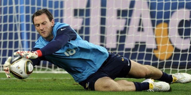 Australia's goalkeeper Eugene Galekovic stops a ball during an official training session in Durban on June 12, 2010. Host South Korea wasted a slew of goal chances as they played Australia to a scoreless draw at the East Asian Cup match here on Saturday.