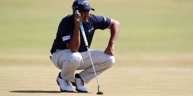 India's Shiv Kapur lines up a putt on the first green during the third round of the 2013 British Open Golf Championship at Muirfield golf course at Gullane in Scotland on July 20, 2013.