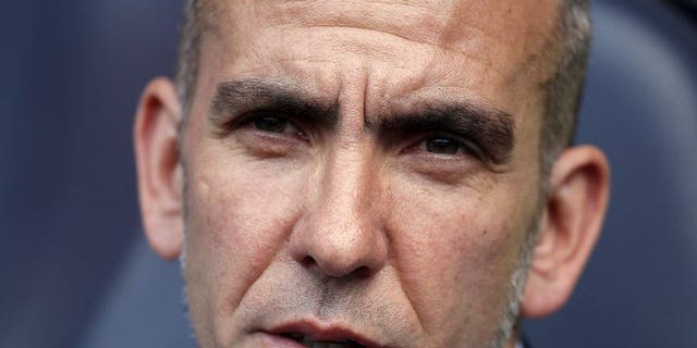 Sunderland's Italian manager Paolo Di Canio is seen at his team's match in London on May 19, 2013. Di Canio has joked he would have to cough up the cash to his players after threatening to fine them if they returned for pre-season overweight.