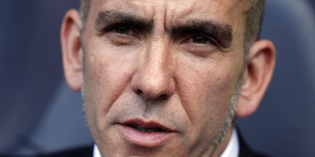 Sunderland's Italian manager Paolo Di Canio is seen at his team's match in London on May 19, 2013. Di Canio has joked he would have to cough up the cash to his players after threatening to fine them if they returned for pre-season overweight.