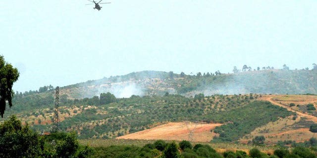 An Algerian army helicopter flies over a zone where troops gfought Islamists in Kabyle zone, east of Algiers August 29, 2007.