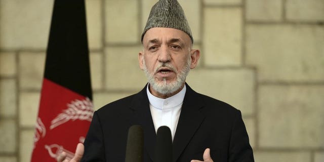 Afghan President Hamid Karzai speaks at a press conference in Kabul, on June 29, 2013. A senior Pakistani official has flown to Kabul, inviting Karzai to Islamabad as part of a charm offensive designed to improve strained relations and help peace efforts with the Taliban.