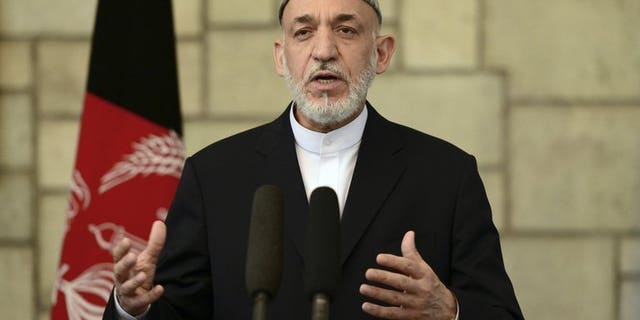 Afghan President Hamid Karzai speaks at a press conference in Kabul, on June 29, 2013. A senior Pakistani official has flown to Kabul, inviting Karzai to Islamabad as part of a charm offensive designed to improve strained relations and help peace efforts with the Taliban.