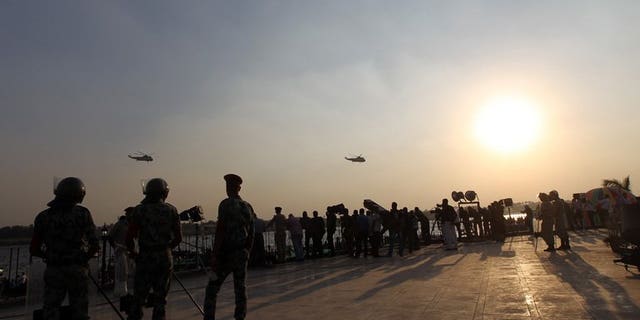 Egyptian soldiers stand guard by the Nile in Cairo, on October 6, 2011. A road accident has killed 15 soldiers and injured another 40 early in Egypt's Nile Delta province of Beheira, a security source tells AFP.