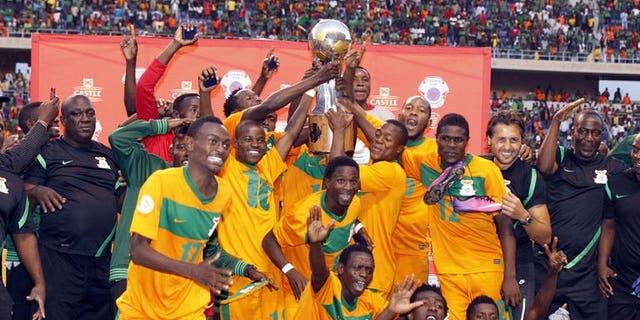 Zambia's players celebrate after beating Zimbabwe during their COSAFA tournament final match in Ndola, on July 20, 2013. Coach Herve Renard has admitted that hosts Zambia were lucky to defeat Zimbabwe.