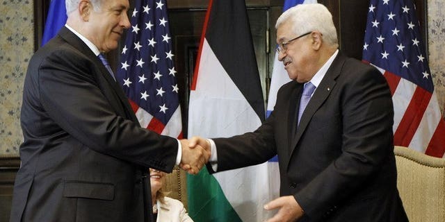 Israeli Prime Minister Benjamin Netanyahu (left) shakes hands with Palestinian president Mahmud Abbas during talks in Sharm El-Sheikh, on September 14, 2010. Iran has voiced opposition to a US-mediated resumption of peace talks between Israel and the Palestinians, predicting the Jewish state would never agree to withdraw from occupied Arab lands.