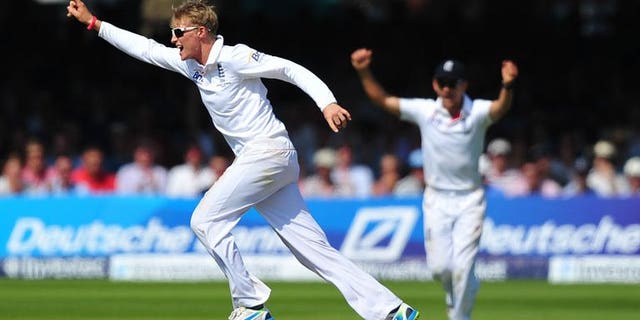 England's Joe Root (left) celebrates after taking the wicket of Australia's Usman Khawaja on the fourth day of the second Ashes Test against Australia at Lord's on July 21, 2013. Root captured two wickets, including the prize scalp of Australia captain Michael Clarke, after making a dominating 180 as England eyed a 2-0 Ashes series lead.