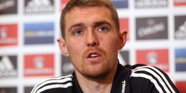 Darren Fletcher speaks during a press conference in Brussels on October 15, 2012. Manchester United midfielder Fletcher admitted on Sunday that he will miss the start of his side's Premier League title defence as he continues to recover from a bowel operation.