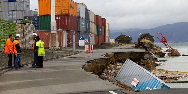 An empty shipping container sits in the harbour where the land fell into the sea at the Port Wellington Container terminal caused by yesterdays earthquake on July 22, 2013.