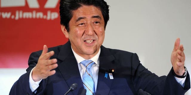 Japanese Prime Minister and ruling Liberal Democratic Party (LDP) leader Shinzo Abe speaks during a press conference at the LDP headquarters in Tokyo on July 22, 2013, a day after victory in the upper house elections. Economic reforms aimed at reanimating Japan's sagging economy will be top of premier Abe's to-do list after his weekend victory tightened his grip on power.