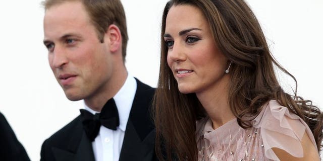 Britain's Duke and Duchess of Cambridge, Prince William (L) and Catherine, arrive for a charity gala dinner, at Kensington Palace in London on June 9, 2011.