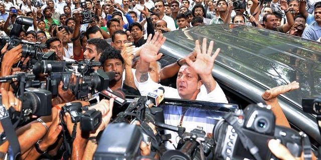 Indian Bollywood actor Sanjay Dutt (C) arrives at the special Terrorist and Disruptive Activities (TADA) court in Mumbai, May 16, 2013. Dutt, who is in jail for arms possession, has lost his final appeal against a decision by the Supreme Court to uphold his conviction.