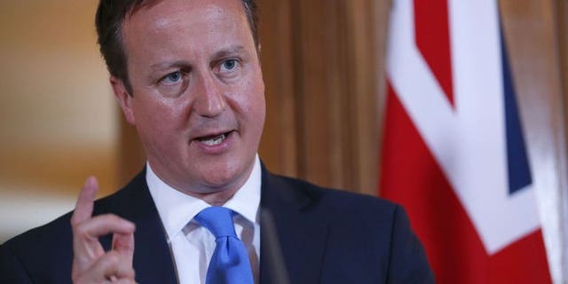 Prime Minister David Cameron speaks during a press conference following a meeting in London on July 17, 2013. The Organization for Security and Cooperation in Europe says that measures promised by Cameron to crack down on online child porn are unlikely to work and risk curbing free speech.
