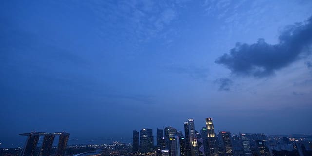 The sun sets over the Singapore skyline on September 17, 2012. A Singapore court on Wednesday charged a senior anti-corruption official with siphoning off more than a million dollars of government money to fund his casino gambling habit.