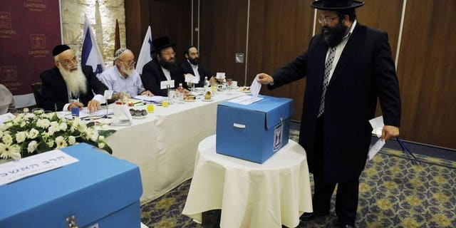 An ultra-orthodox Jew casts his ballot during the election for Israel's two chief rabbis held in Jerusalem on July 24, 2013. Two rabbis backed by ultra-orthodox parties were elected on Wednesday to serve as Israel's chief rabbis for the next 10 years, an official announcement says.
