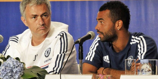 Chelsea football club manager Jose Mourinho (L) listens as player Ashley Cole (R) speaks during a press conference at a hotel in Jakarta on July 23, 2013. Chelsea turned on the style in an 8-1 rout of Indonesia All-Stars Thursday as they completed their Asian tour with a 100 percent record under returning manager Mourinho.