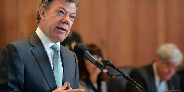 Handout picture released by the Colombian Presidency showing Colombia's President Juan Manuel Santos delivering a speech at the Constitutional Court in Bogota, Colombia, on July 25, 2013. Colombia admitted for the first time Thursday that the government has been guilty of "serious human rights violations" during its 50-year battle with leftist rebels.