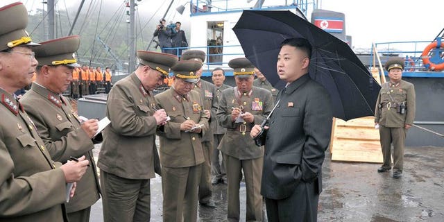 This undated picture released by North Korea's official Korean Central News Agency (KCNA) on May 28, 2013 shows North Korean leader Kim Jong-Un (R, front) inspecting the August 25 Fishery Station under the Korean People's Army (KPA) Unit 313. Kim has held talks with China's Vice President Li Yuanchao during commemorations of the anniversary of the Korean War ceasefire, state media said Friday.
