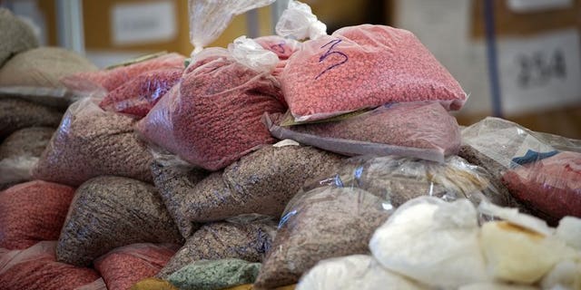 Bags of methamphetamine pills seized by the Thai narcotic police department are seen on display before being incinerated in Ayutthaya on September 17, 2011. Two Indian men have been arrested and charged in Thailand with trafficking crystal methamphetamine worth an estimated $1.4 million, a customs official said Friday.