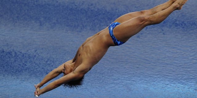 China's He Chong competes in the men's 3-metre springboard final diving event in the FINA World Championships at the Piscina Municipal de Montjuic in Barcelona on July 26, 2013.