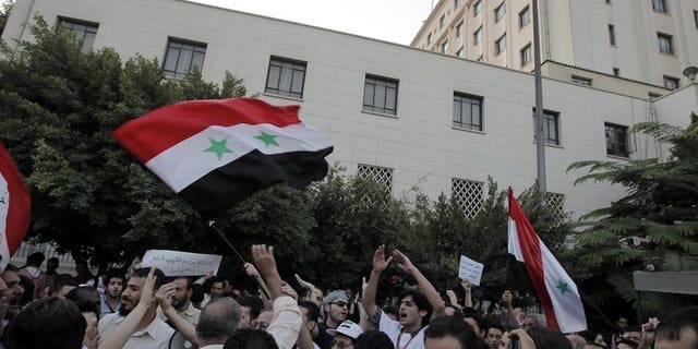 Syrians living in Egypt protest against President Bashar al-Assad in Cairo on October 16, 2011. Rising anti-Syrian rhetoric and arbitrary arrests are pushing a growing number of Syrian war exiles in Egypt to seek UN protection, the world body's refugee agency said Friday.