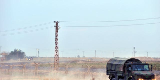 Turkish soldiers patrol on the Turkish-Syrian border near the town of Ceylanpinar on November 11, 2012. A man was killed and his three children wounded Friday in southeastern Turkey by a mortar shell fired from across the border with conflict-torn Syria, a newspaper reported.