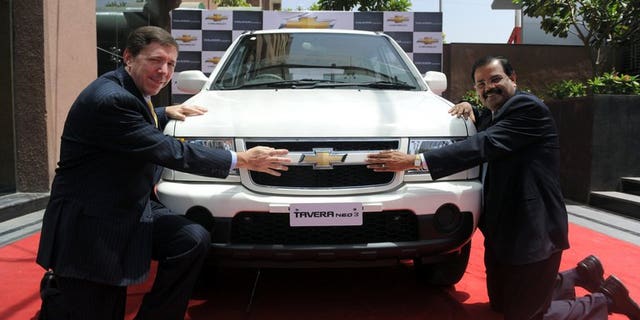 General Motors India's president and managing director Lowell Paddock (left) and vice president of corporate affairs GM India P Balendran in Ahmedabad on March 23, 2012. GM said Saturday it has fired "several employees" after violations of company policy led to the recall of 114,000 of its Chevrolet Tavera sport-utility vehicles in India.