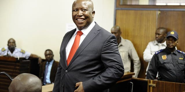 South African populist firebrand Julius Malema smiles as he arrives in court on September 26, 2012 in Polokwane. Malema launched South Africa's newest political party Saturday to take on his former party, the ruling African National Congress (ANC), in polls next year.
