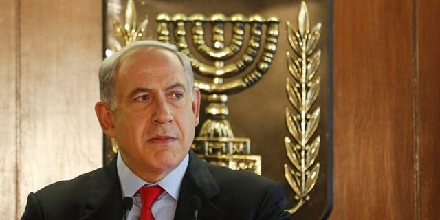 Israel's Prime Minister Benjamin Netanyahu speaks at the Knesset in Jerusalem on July 22, 2013. Netanyahu said on Saturday that Israel will free 104 Palestinian prisoners to coincide with the resumption of long-stalled peace talks.