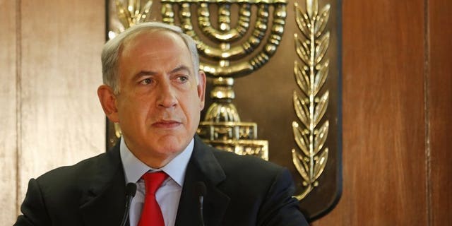 Israel's Prime Minister Benjamin Netanyahu speaks at the Knesset in Jerusalem on July 22, 2013. Netanyahu said on Saturday that Israel will free 104 Palestinian prisoners to coincide with the resumption of long-stalled peace talks.