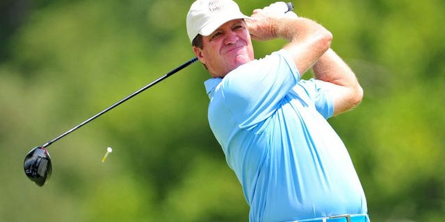 Steve Elkington of Australia watches his tee shot on August 11, 2011. He became the latest Australian sports figure to be at the centre of a racism row when the golfer insisted he'd no idea 'Pakki' was an abusive term as he apologised for offensive Twitter messages.