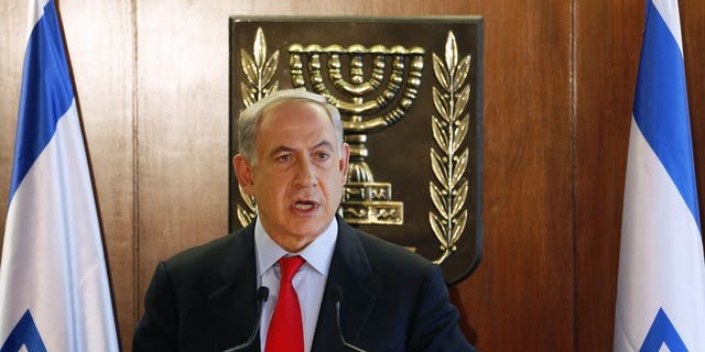 Israel's Prime Minister Benjamin Netanyahu delivers a statement to the media, in Jerusalem, on July 22, 2013. He will seek cabinet approval on Sunday for a contentious release of 104 veteran Palestinian and Israeli-Arab prisoners, to coincide with the resumption of peace talks.
